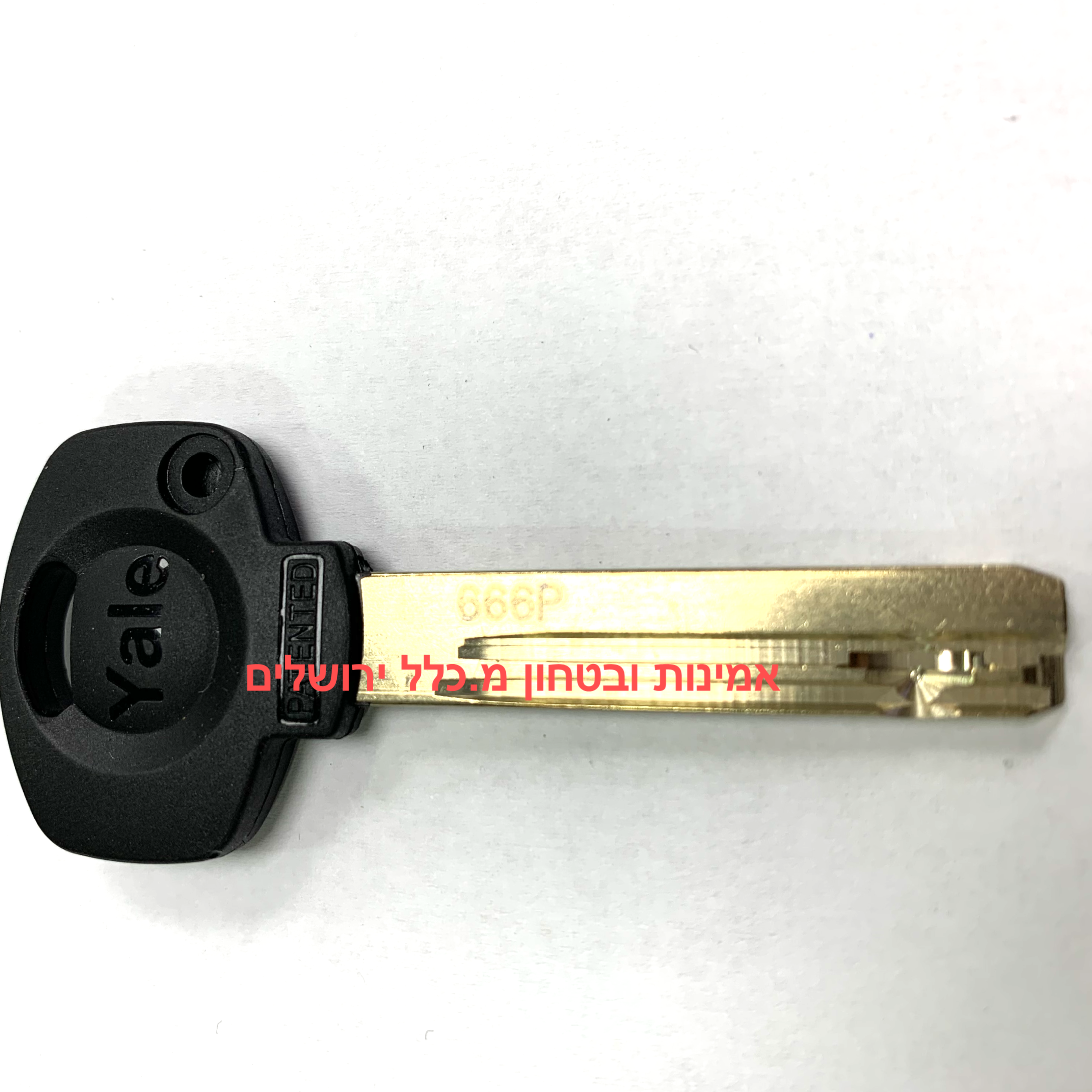 Yale key blade on a white background